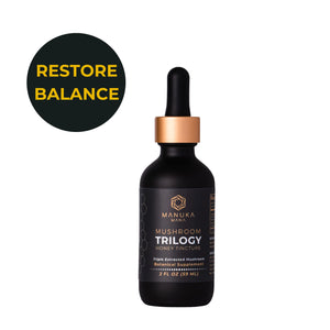 Manuka Mana Mushroom Trilogy tincture bottle on white background.