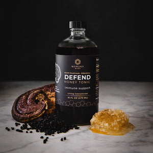 Reishi Defend Tonic pictured with ingredients.