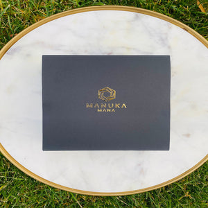 Black Manuka Mana box with elegant gold lettering. 