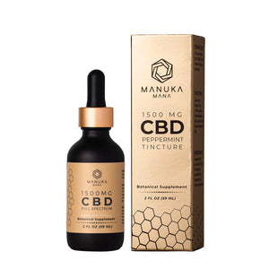 Manuka Mana's 1500mg CBD tincture is pictured next to its packaging. 