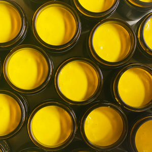 Jars of Manuka Mana's Superfood Honeyblend are pictured from above with their lids off, so you can see the honeyblend in the jars. 