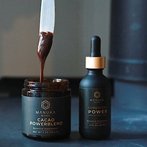 Decadent chocolate dripping from a butter knife back into the jar next to bottle of Cordyceps Energy Tincture.